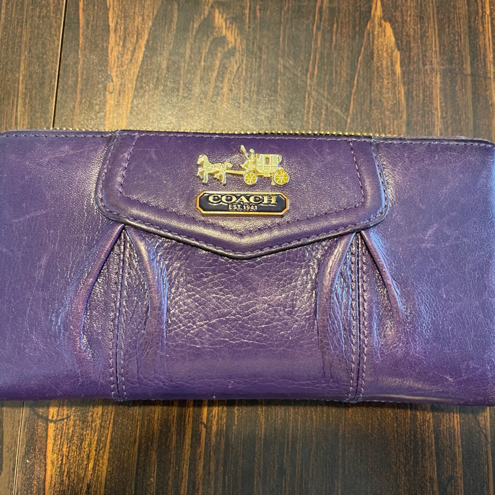 Beautiful deep purple Coach wallet. Good shape. Just a few scuffs from use.